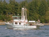 Pau Hana II, 1960s vintage, wood, built in Santa Barbara, still cruising in the Pacific NW